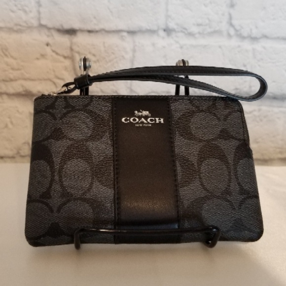 Coach Handbags - Coach Black Charcoal Signature C Pattern Wristlet!